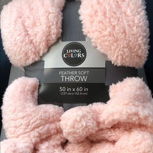 Fuzzy pink throw blanket